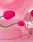 Side view of pink Adult Rose Toy with an open rose head, two buttons and a smaller bud connected by a curved green stem