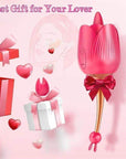 Pink Alvina rose tongue vibrator with its slender stem and silicone attachments pictured beside decorative gift boxes and ribbons