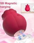 Rose Women Toy underside with two metal charging contacts aligned to a white magnetic USB base