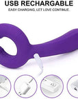 Purple Y-1 vibrator in a side view with two curved ridged tips, a long body and white USB charging cable