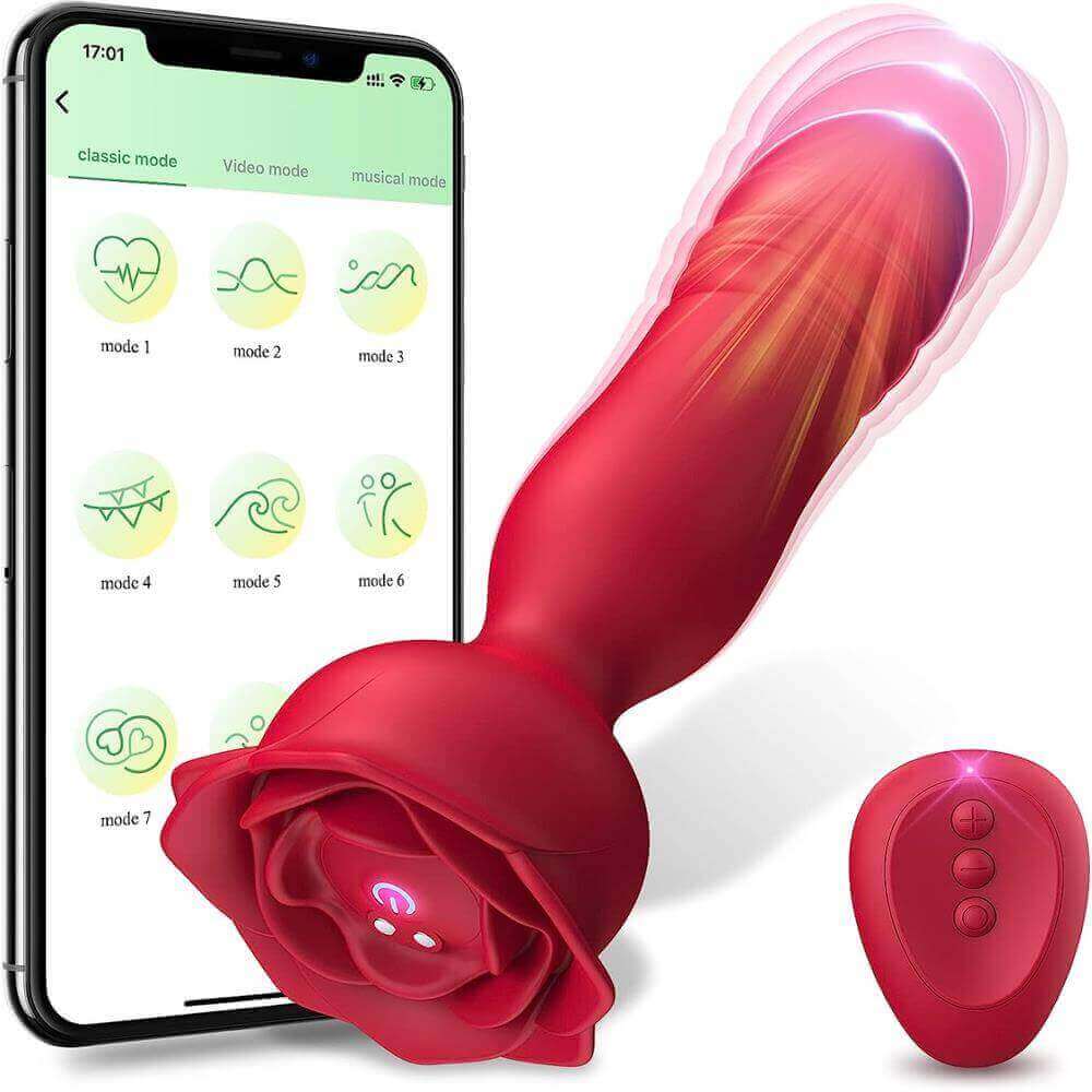 Red app-controlled rose thrusting plug with a tapered rounded shaft, wide petal base, underside power button and contacts, pictured beside a three-button remote and phone