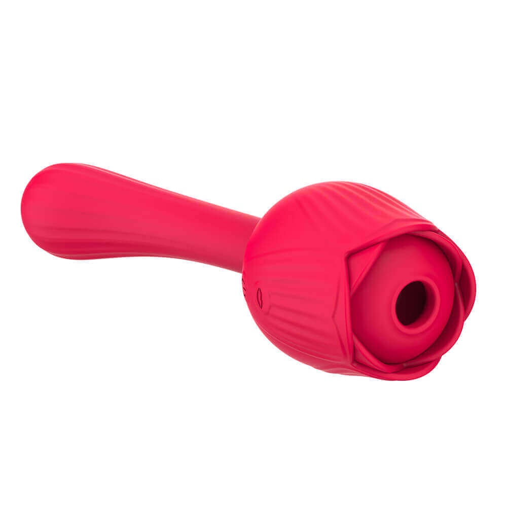 Angled view of the red Dora rose vibrator showing the central air-pulse opening framed by petals and its curved opposite stem