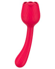 Red Dora rose suction vibrator with a central air-pulse opening, two front buttons and an elongated curved textured stem