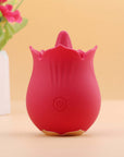 Red Doreen rose tongue vibrator standing upright with a projecting tongue, layered petal rim, single front power button and gold-colored base trim