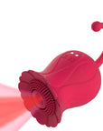 Red flower suction toy with textured contact rim, open center, two charging contacts and a curved rounded-tip tail