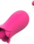 Pink flower tongue vibrator with an open petal head, one button and a rounded bead tip on a narrow opposite stem