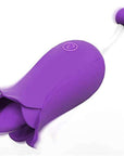 Purple flower tongue vibrator with a raised central tongue, one body button and a rounded bead tip on a narrow white stem