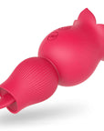 Angled view of the pink Holly rose vibrator showing the projecting tongue inside the ribbed opposite end and two buttons on the flower body