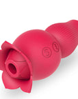 Pink Holly dual-ended rose vibrator viewed from the flower end, showing its central suction opening, side S button and wave button