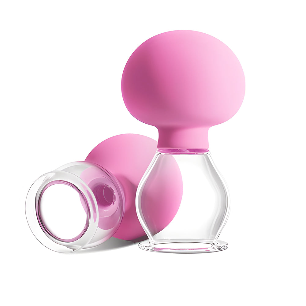 Pair of manual suction cups with pink squeeze bulbs and transparent chambers