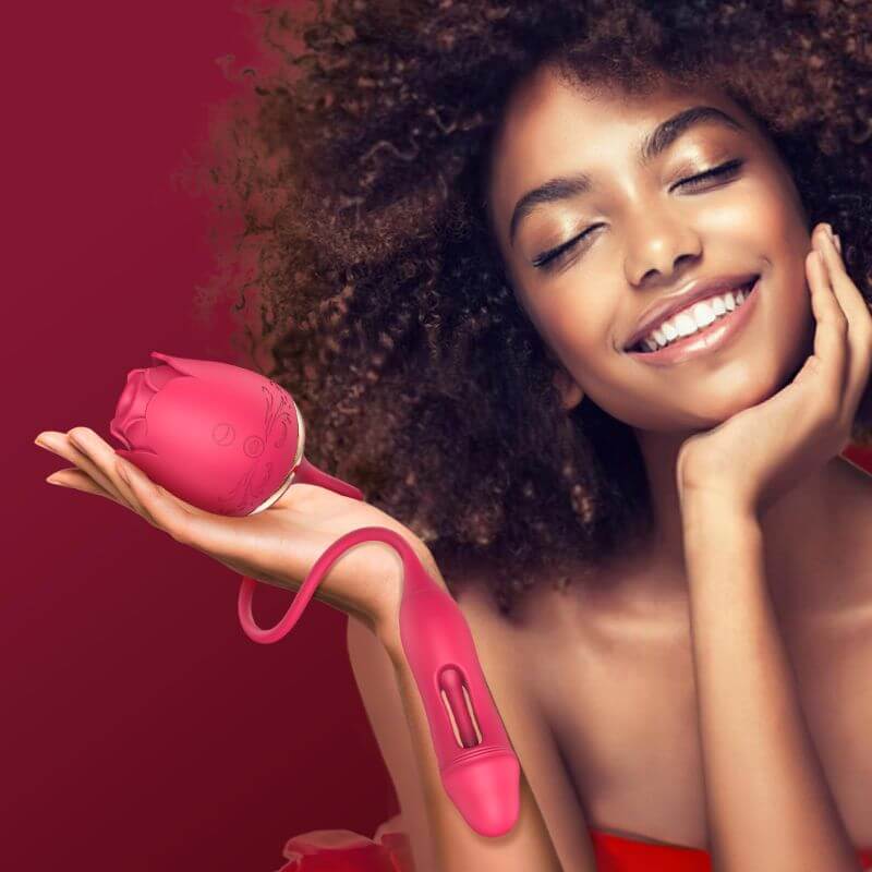 Adult model holding the pink rose suction body with its connected flapping vibrator visible