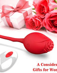 Red rose vibrating egg and white wireless remote arranged beside red roses and a decorative white gift box with a pink ribbon