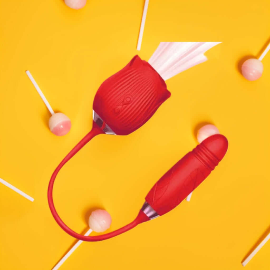 Red ribbed rose suction vibrator and connected textured lower arm on a yellow background