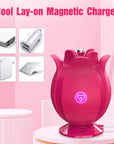 Pink rose massager standing on its magnetic charging base with USB power-source illustrations